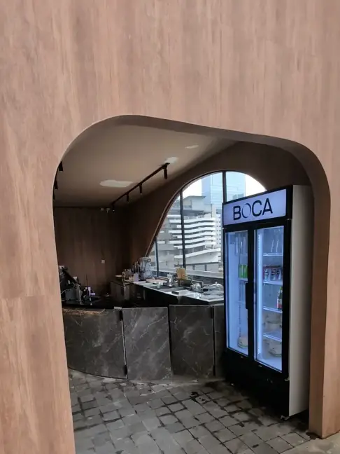 Arched timber entrance to the drinks corner