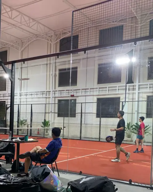 Evening game on the terracotta court