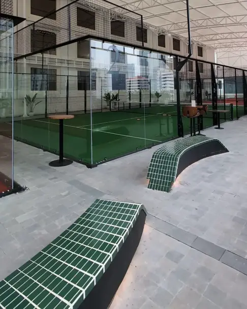 Tiled benches beside the court